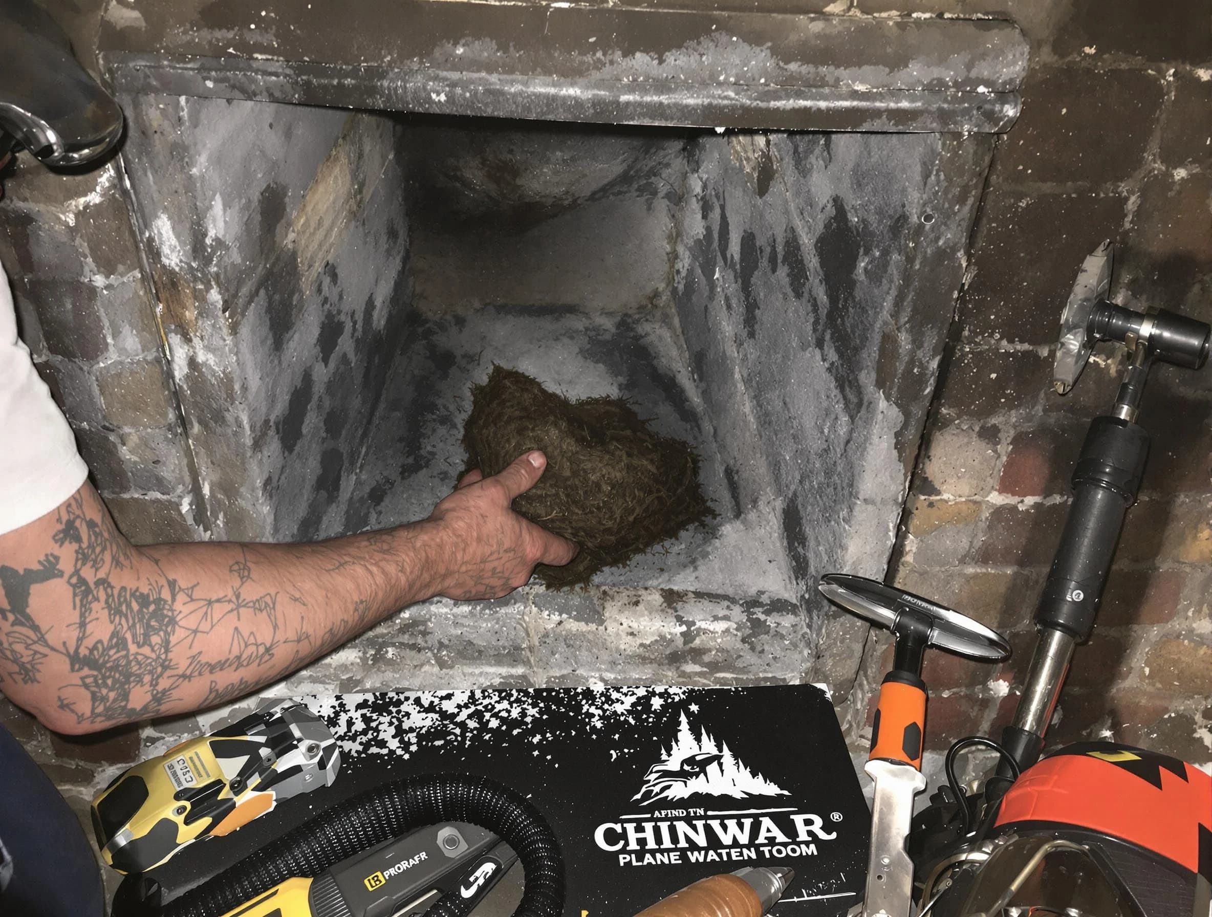 Dracut Chimney Sweep safely removing debris and screening chimney in Dracut, MA