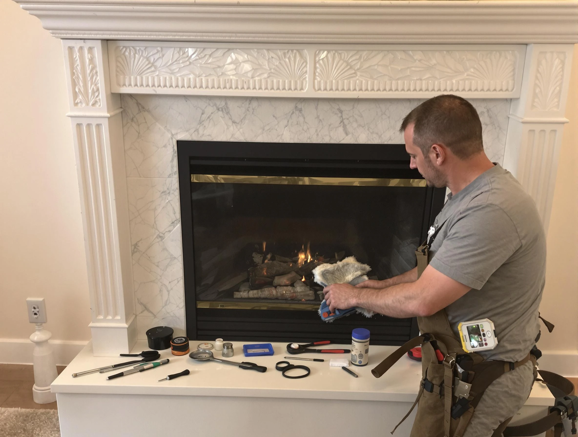 Dracut Chimney Sweep performing fireplace maintenance in Dracut, MA